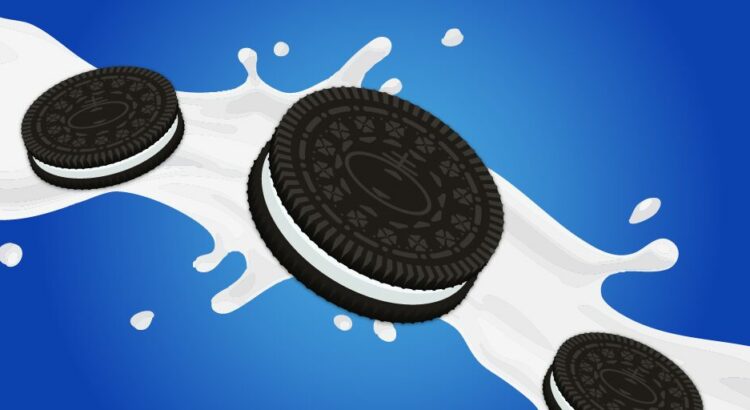 A group of original OREO chocolate sandwich cookies splashing into milk.